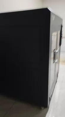 The ultra-large 3D printer is placed in the garage under the - Photo taken in person